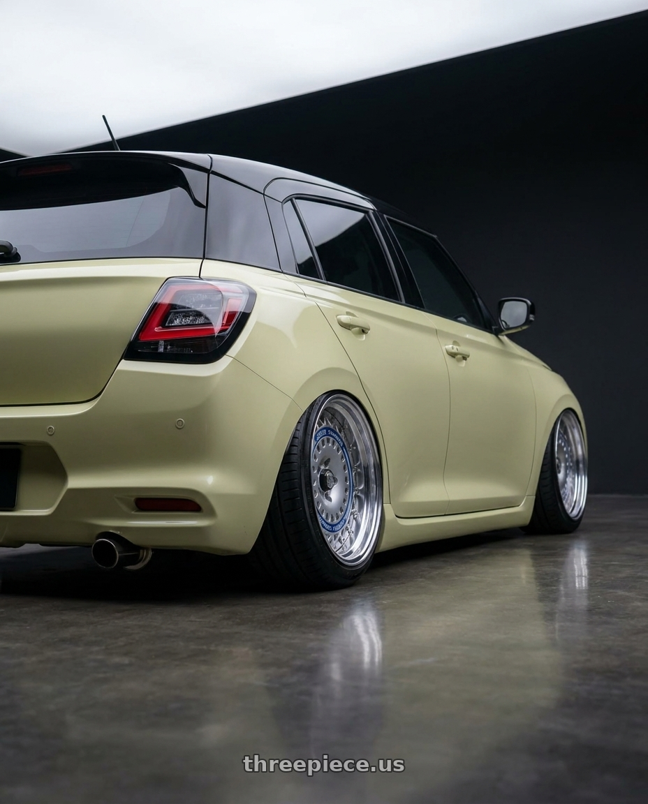 2026 Suzuki Swift with FORMULA AERO MESH 4x100 16X7+38 NR Disk Titan Silver wheels rear three quarter view square tires