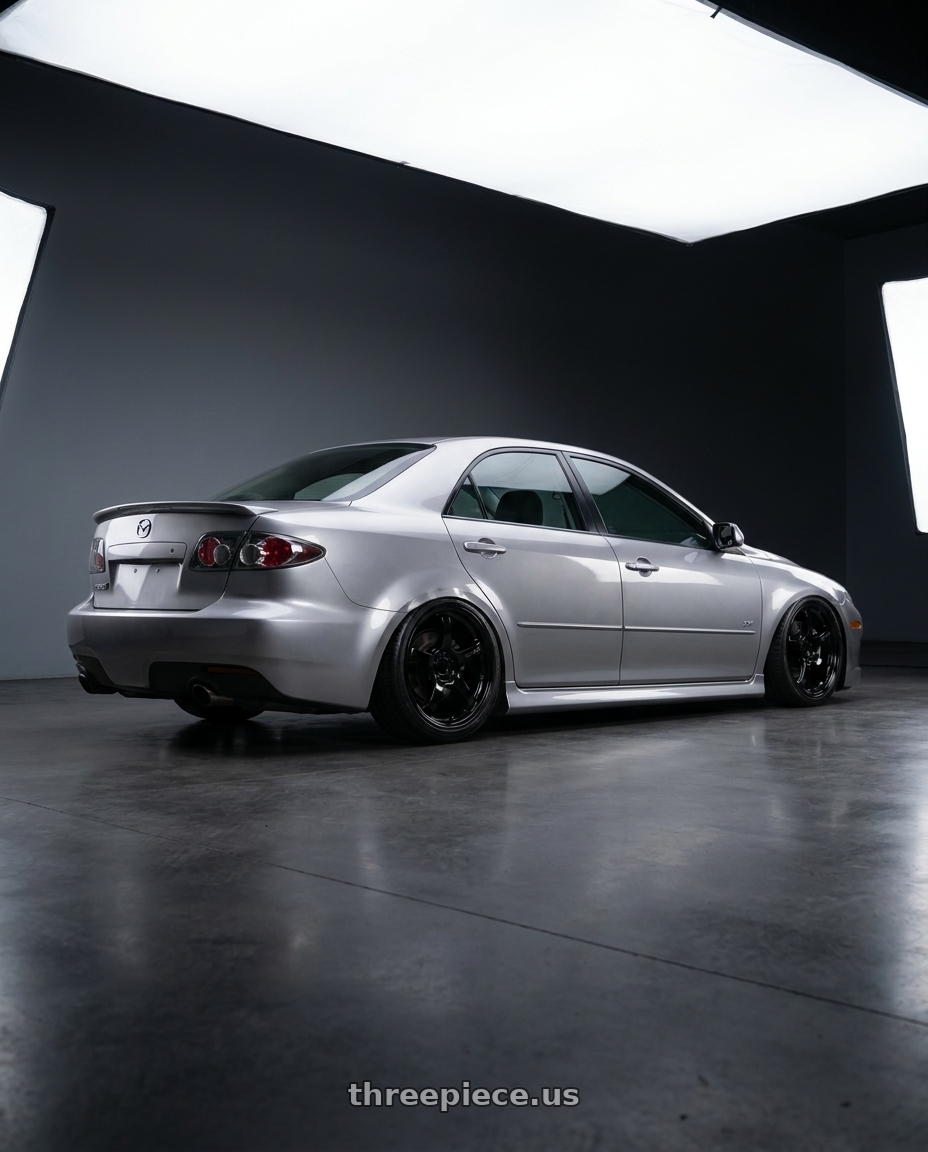 2006 Mazda speed6 with Gram Lights 57CR 5x100 18x9.5+38 Glossy Black wheels rear three quarter view slight stretch tires