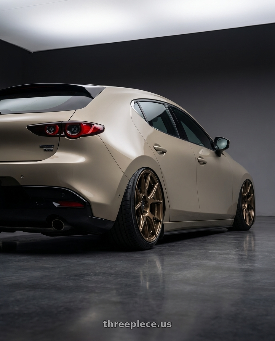 2023 Mazda Mazda3 Turbo with Konig Ampliform 5x114.3 18x10+20 Gloss Bronze wheels rear three quarter view slight stretch tires