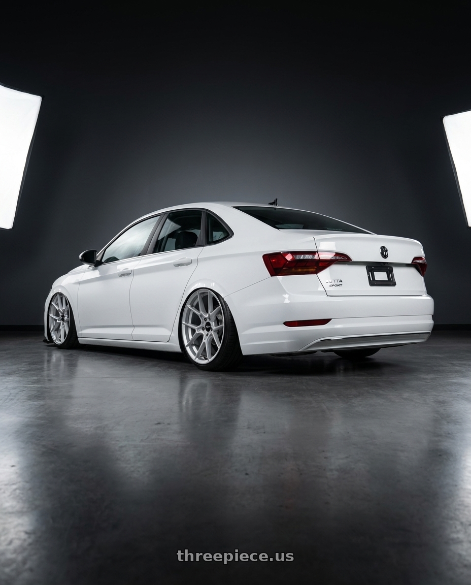 2023 volkswagen jetta sport with Rotiform RC199 KPR 5X120 20x10.5 +40 SILVER wheels rear three quarter view slight stretch tires