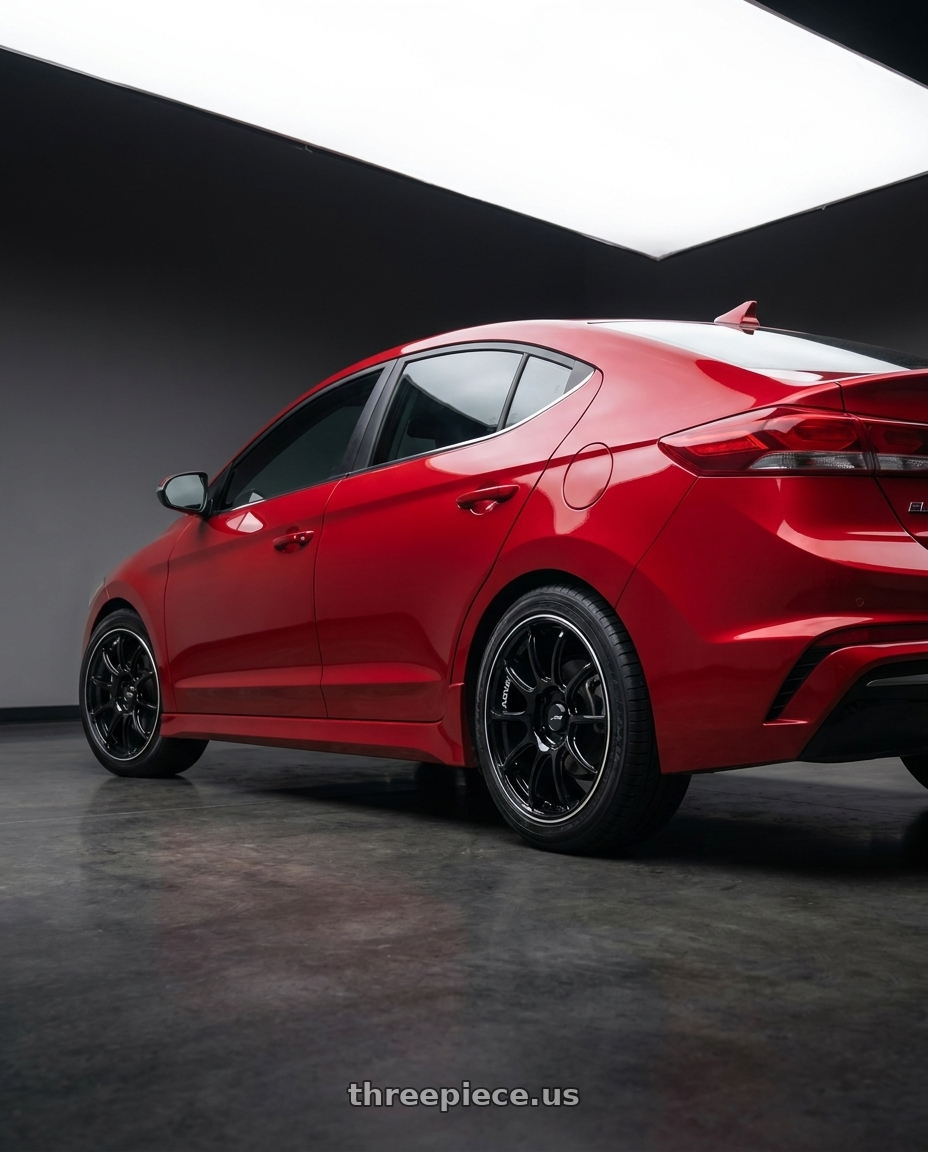 2017 Hyundai Elantra with Advan RZ II 5x100 17x8.0+45 Racing Gloss Black and Ring wheels rear three quarter view square tires