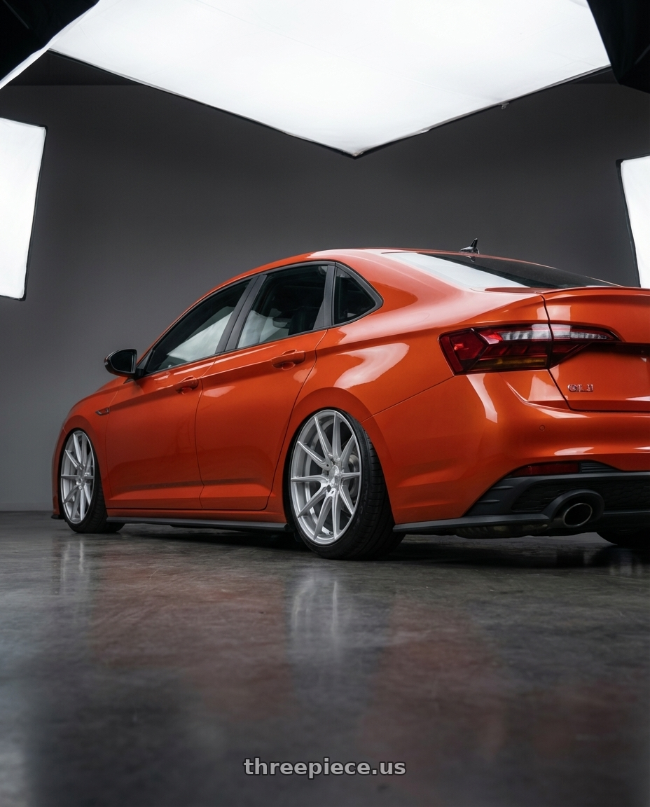 2023 Volkswagen Jetta GLI MK7 with Avant Garde Wheels M652 5X112 19x9.5 +48 Silver Machine wheels rear three quarter view slight stretch tires