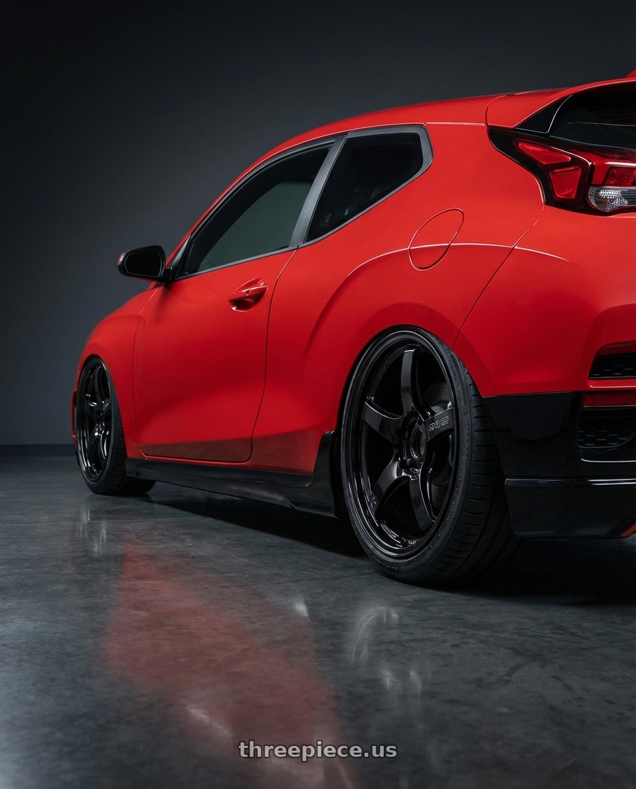 2022 Hyundai Veloster N with Gram Lights 57CR 5x114.3 19x8.5+35 Glossy Black wheels rear three quarter view slight stretch tires