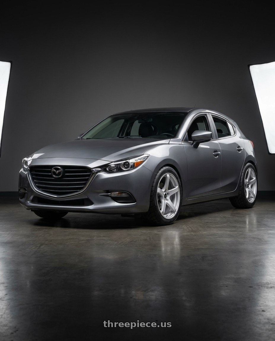 2017 Mazda 3 Touring with Enkei Kojin 5x114.3 18x8+40 Matte Silver wheels front three quarter view lowered stance