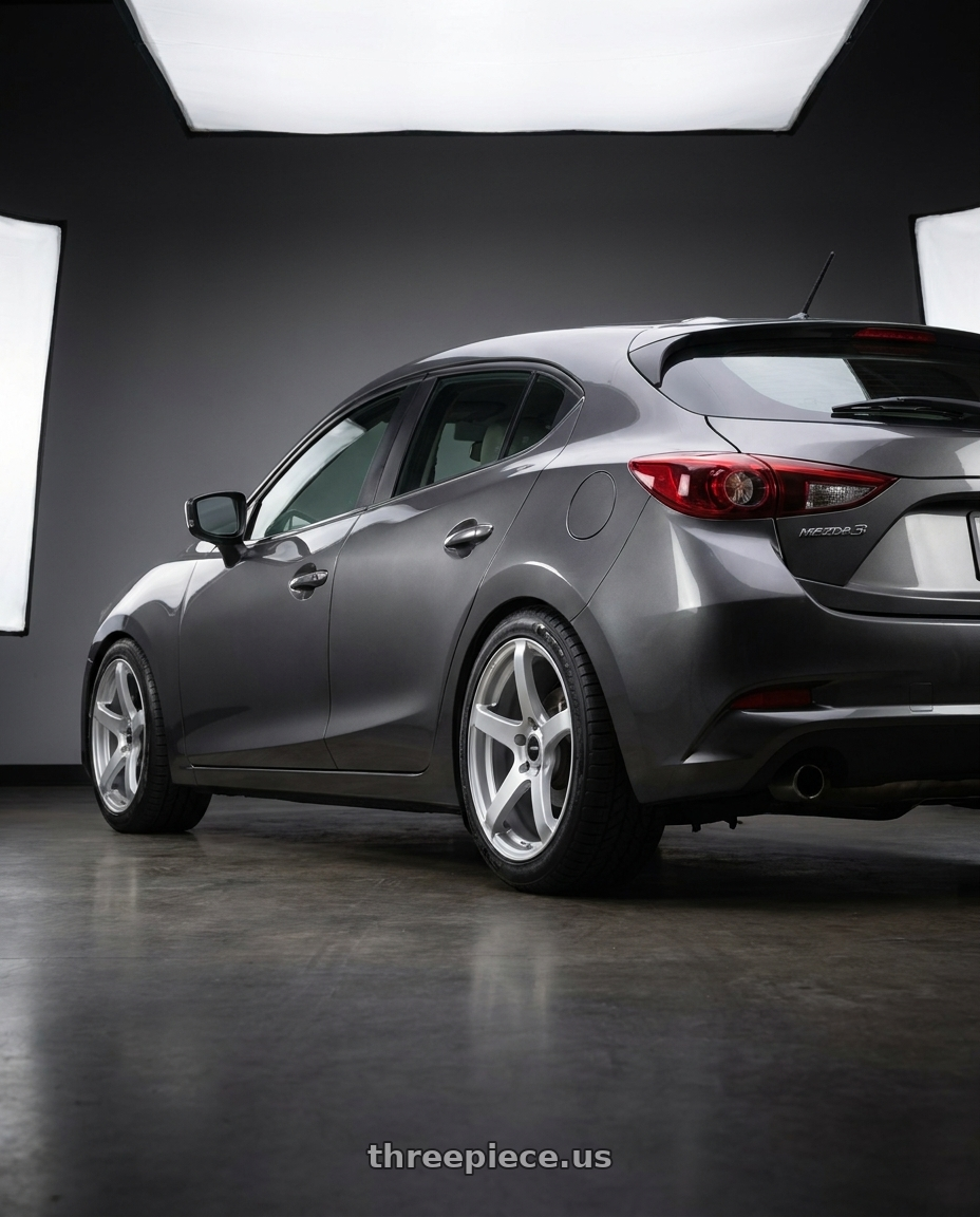 2017 Mazda 3 Touring with Enkei Kojin 5x114.3 18x8+40 Matte Silver wheels rear three quarter view meaty tires