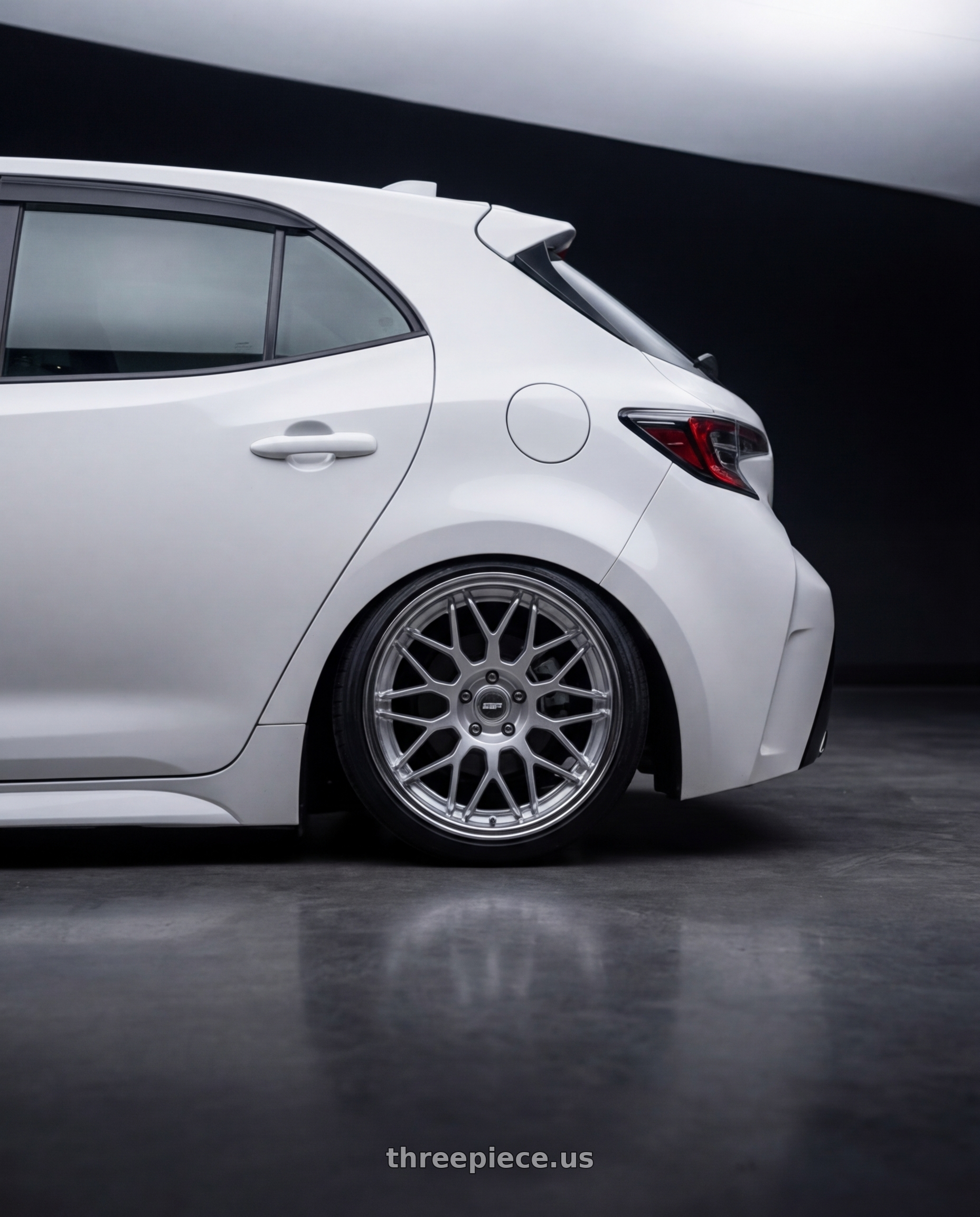 2023 Toyota Corolla Hatchback with ESR Wheels APEX SERIES APX01 5x114.3 18x8.5 +30 Hyper Silver wheels rear three quarter view slight stretch tires