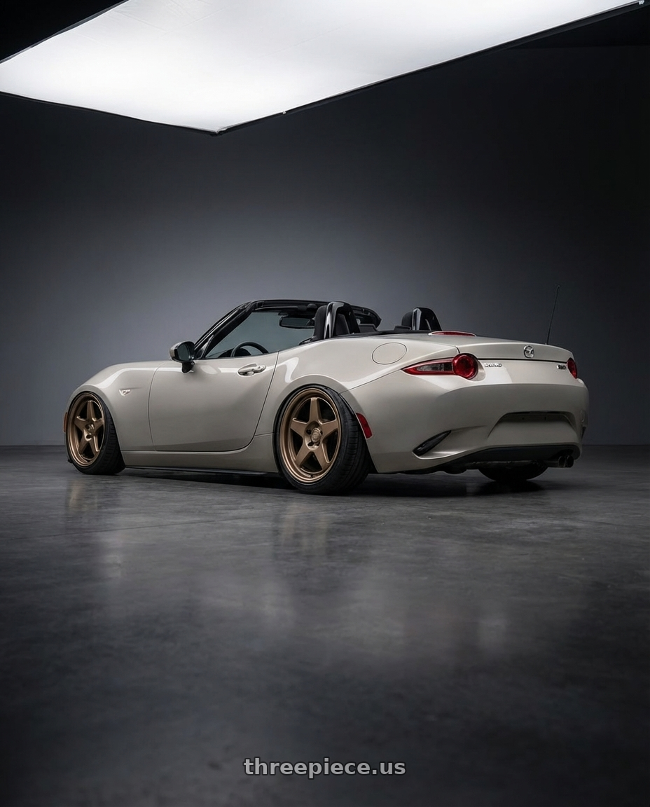 2021 Mazda MX-5 Miata ND with Kansei K12B KNP 5x114.3 17x9 35 Bronze wheels rear three quarter view slight stretch tires