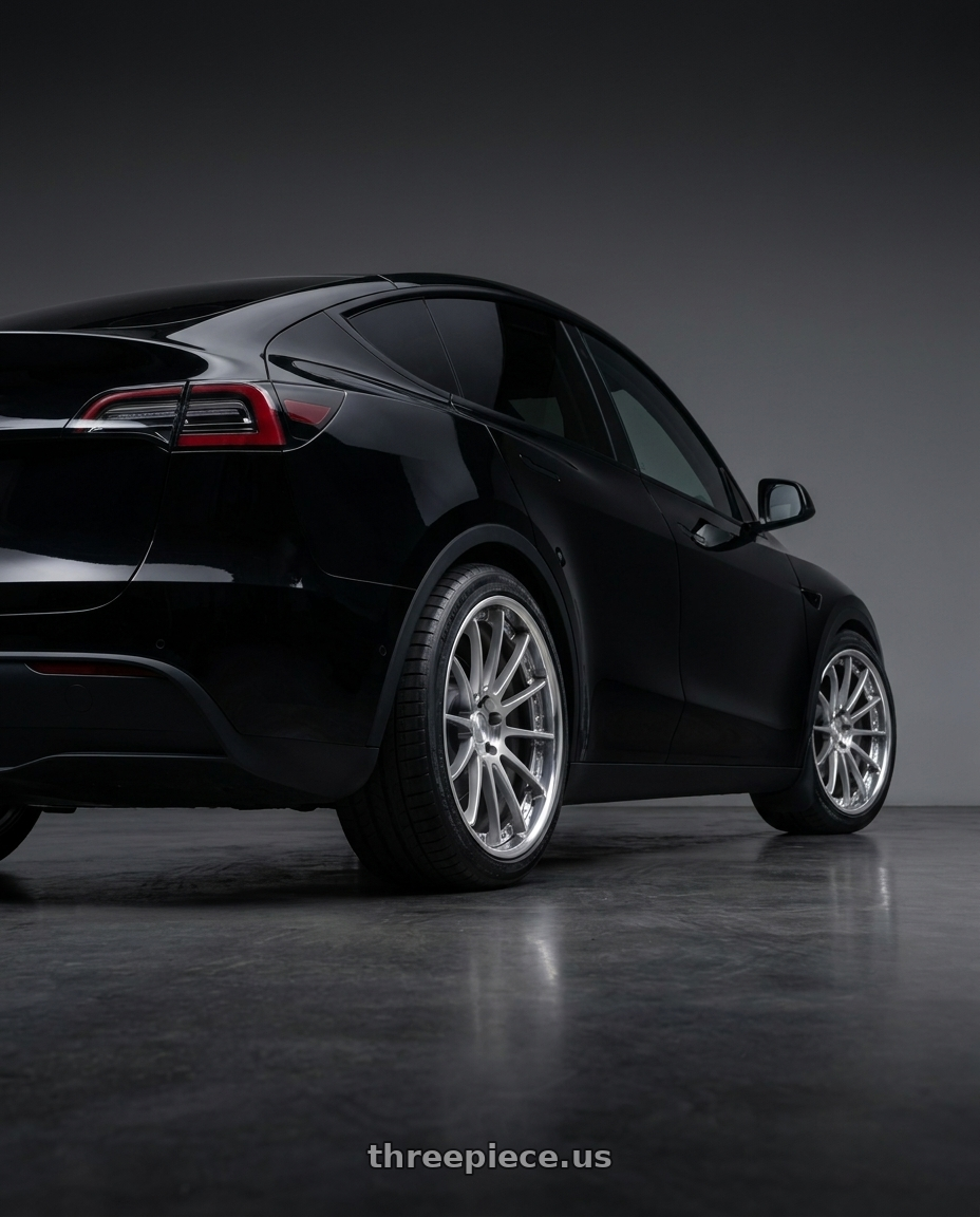 2026 Tesla model y with EXECUTOR CV04S 5x114.3 21X10.5+-1 NR Disk Titan Silver wheels rear three quarter view square tires