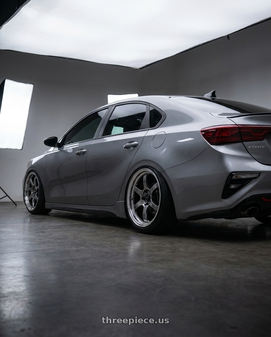 2024 Kia forte gt line with Vors LT61 5x114.3 17x7.5 +35 Hyper Black wheels rear three quarter view extreme stretch tires