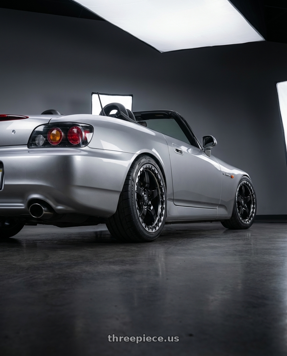 2009 Honda S2000 with Forgestar D5 Beadlock 5x114.3 17x10 +50 Gloss Black Machined wheels rear three quarter view square tires