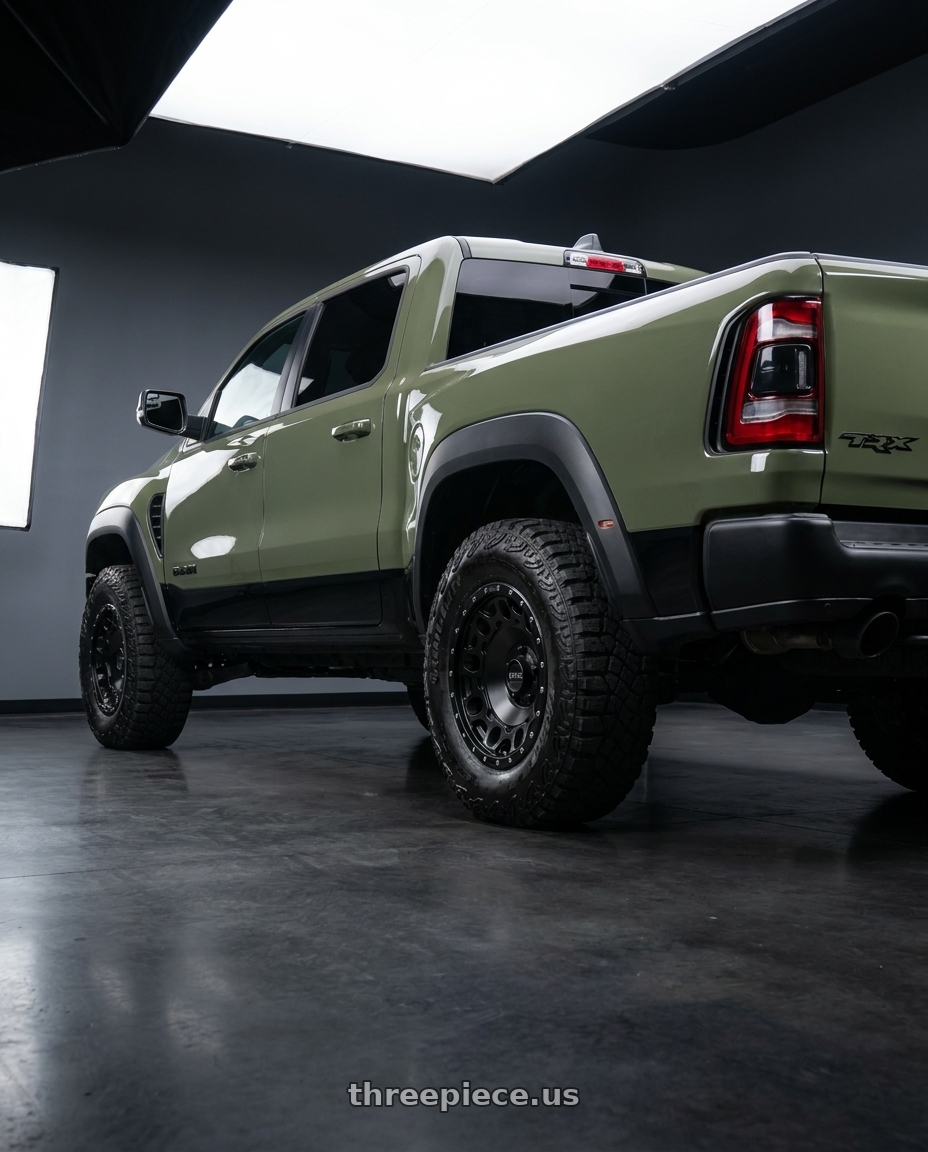 2026 ram rho with KMC KM529 HOLESHOT 5X120 17X8.5 +34 SATIN BLACK wheels rear three quarter view meaty tires