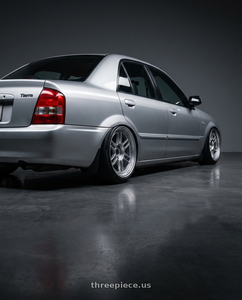 2001 Ford tierra with Enkei RPF1RS 5x114.3 18x9.5+12 Silver wheels rear three quarter view slight stretch tires