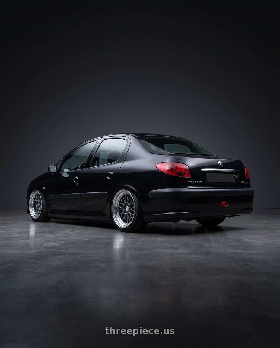 2011 Peugeot 206 SD with ESR Wheels SR SERIES SR05 5x108 17x8.5 +30 Gloss Graphite wheels rear three quarter view slight stretch tires