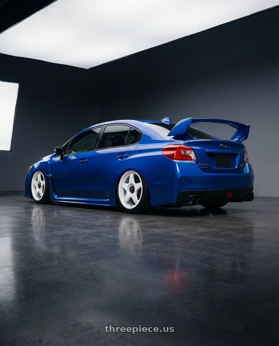 2018 Subaru WRX STI with fifteen52 CHICANE 5x114.3 / 5x100 18x8.5 +35 RALLY WHITE (GLOSS WHITE) wheels rear three quarter view slight stretch tires