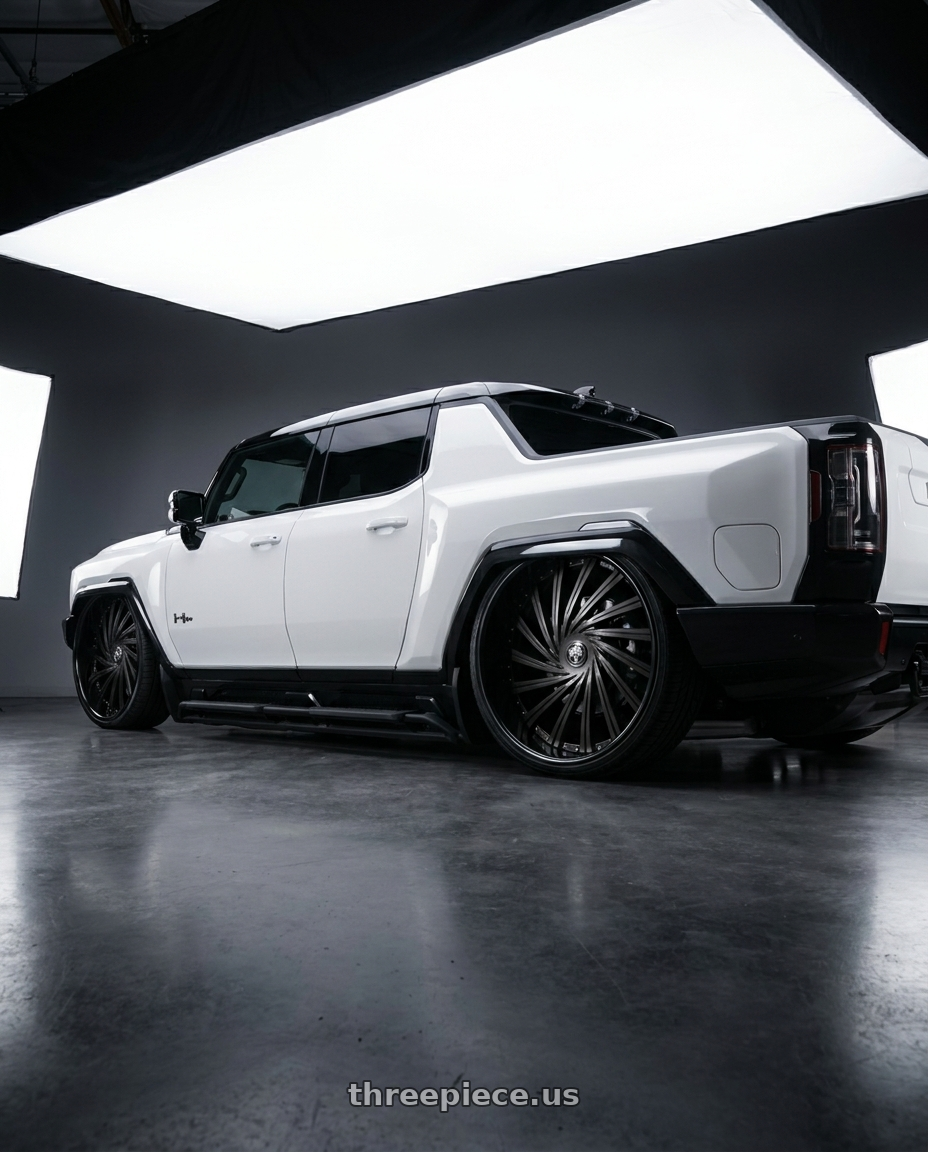2026 GMC Hummer EV with DUB 2PC S241 DAZED 5X120.65/5X127 28X9 +5 MATTE BLACK DOUBLE DARK TINT wheels rear three quarter view slight stretch tires