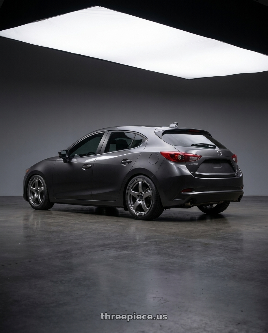 2017 Mazda Mazda3 Grand Touring with Enkei PF05 5x114.3 18x8.5+38 Dark Silver wheels rear three quarter view square tires