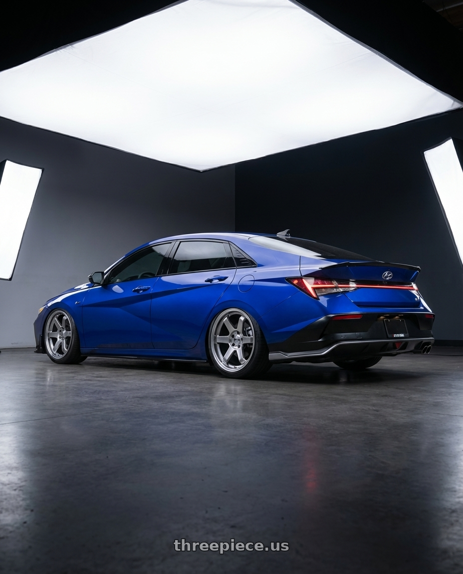 2025 Elantra N Line  with F1R F106 5x114.3 17x8 +35 Hyper Black wheels rear three quarter view square tires