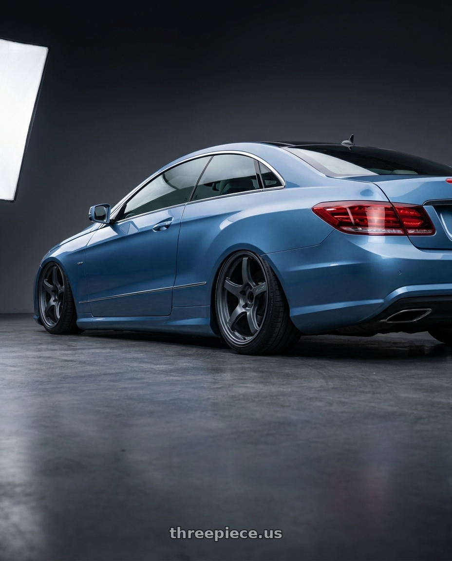 2014 Mercedes-Benz E-Class Coupe C207 with Gram Lights 57CR 5x112 19x10.5+22 Gunblue II wheels rear three quarter view slight stretch tires