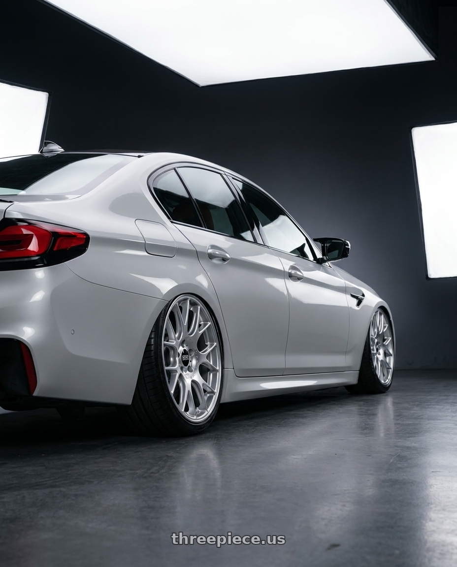 2022 BMW M5 F90 with BBS CH-R 5x112 20x8.5 +40 Brilliant Silver Polished Rim Protector wheels rear three quarter view square tires