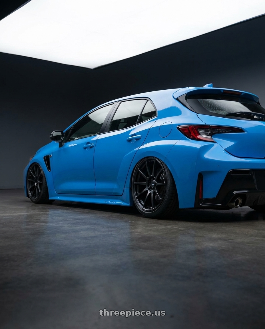 2024 Toyota GR Corolla with Ssr Gtv02 5x114.3 18x8.5+40  FLAT BLACK wheels rear three quarter view slight stretch tires