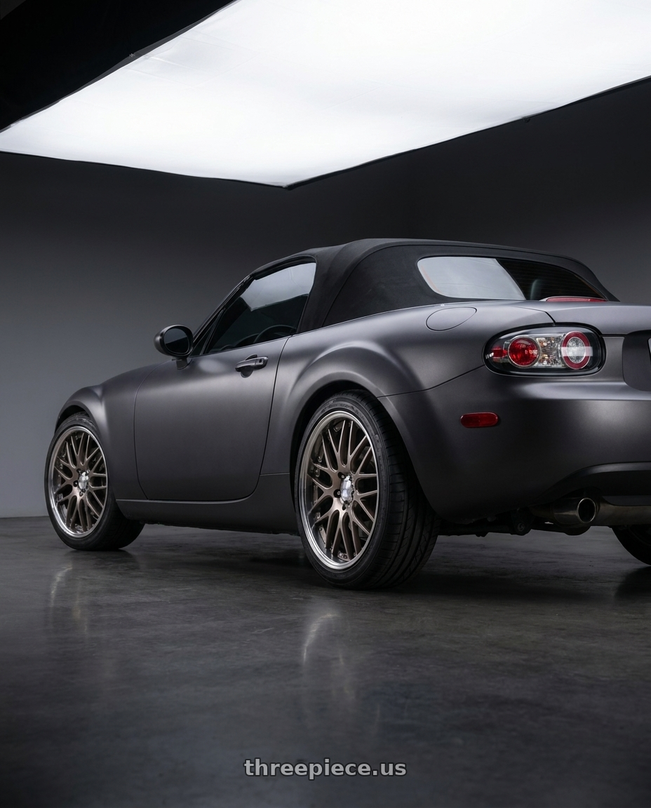 2007 Mazda Miata MX-5 with Work Lanvec Lm1 5x114.3 18x8+45 A Disk Trans Gray Polish wheels rear three quarter view square tires
