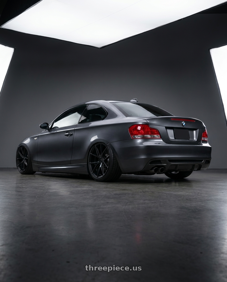 2012 BMW 1 Series E82 with Niche 1PC M117 MISANO 5X120 18X9.5 +40 MATTE BLACK wheels rear three quarter view slight stretch tires