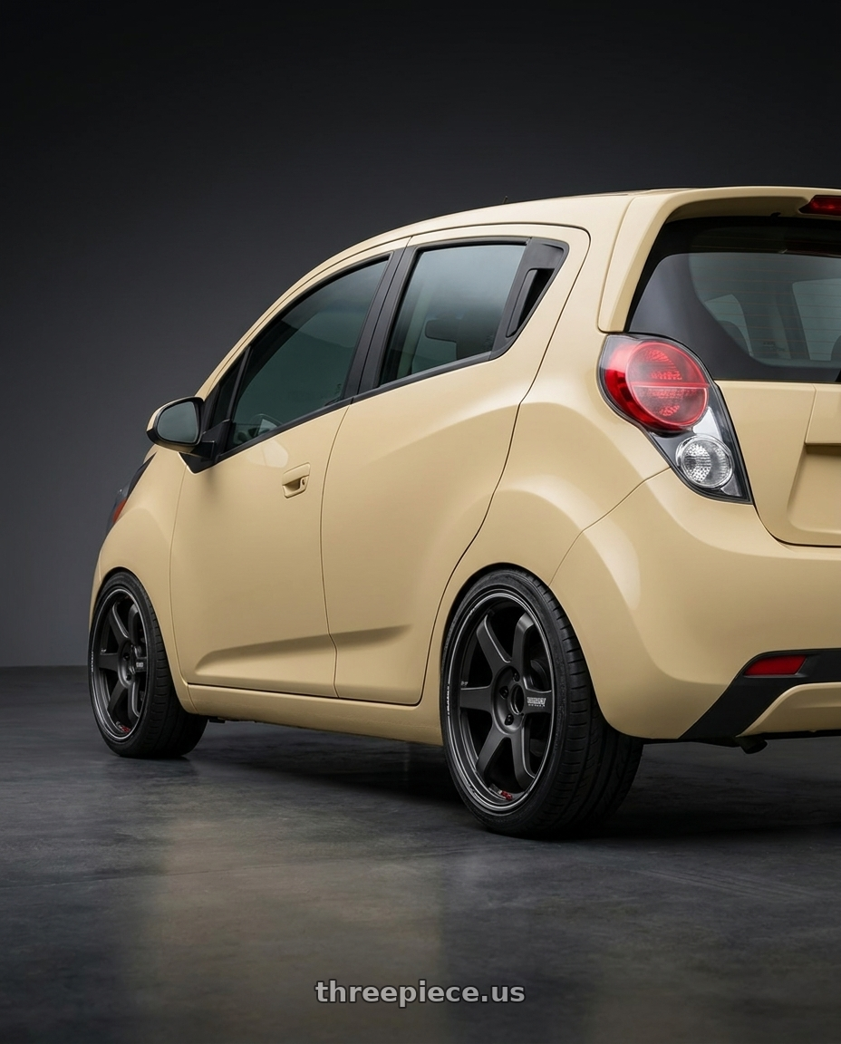 2015 Chevy Spark LT  with Volk Racing TE37 Ultra Track Edition II 5x114.3 20x9.5+45 wheels rear three quarter view slight stretch tires