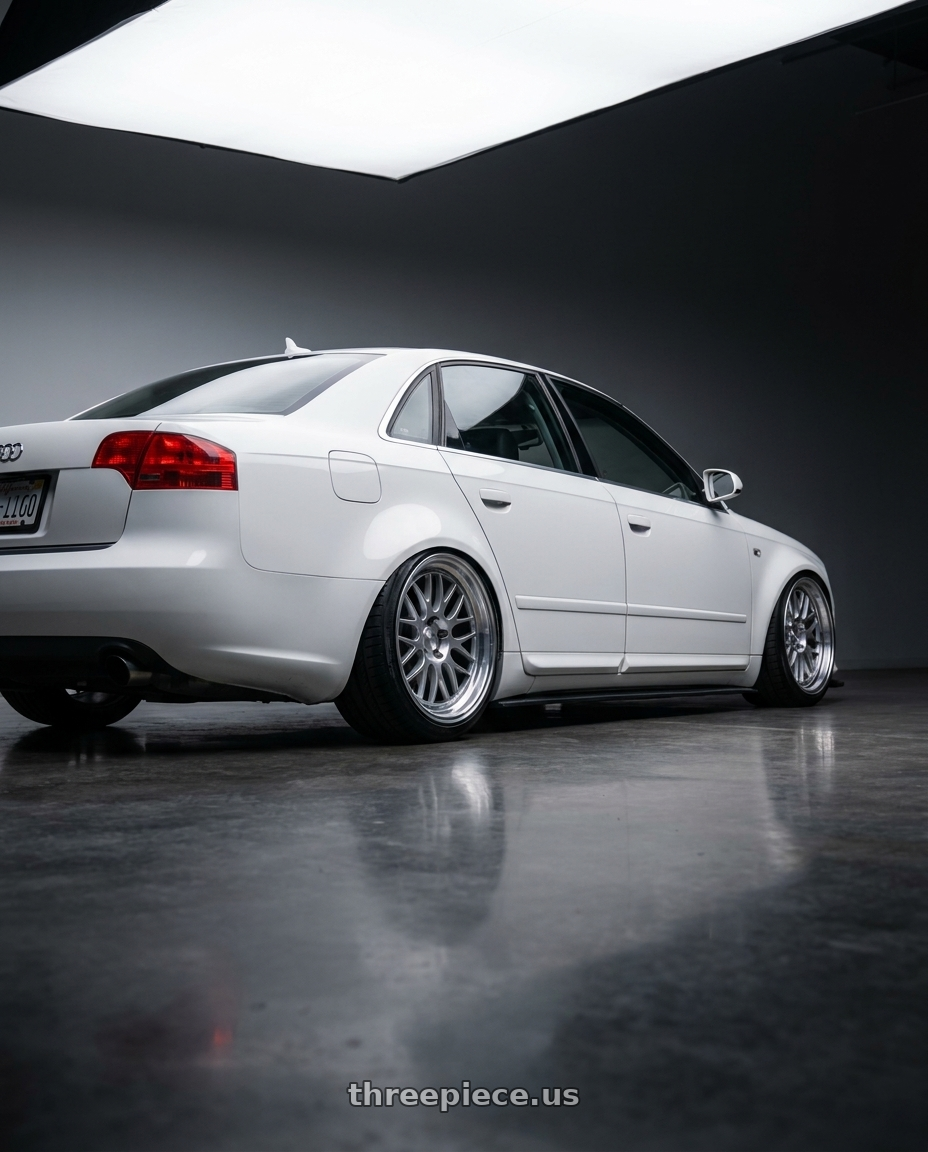 2010 Audi A4 B7 with Kansei K11S Tandem 5X112 19x10.5 22 Hyper Silver wheels rear three quarter view slight stretch tires