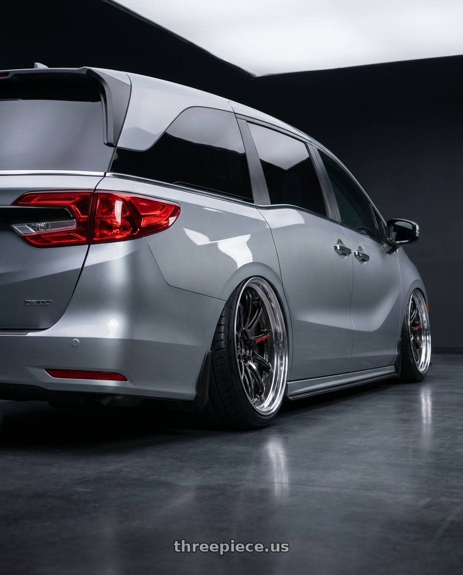 2024 Honda Odyssey  with Work Zr10 2P 5x120 20x10.5 +38 Glim Black wheels rear three quarter view extreme stretch tires