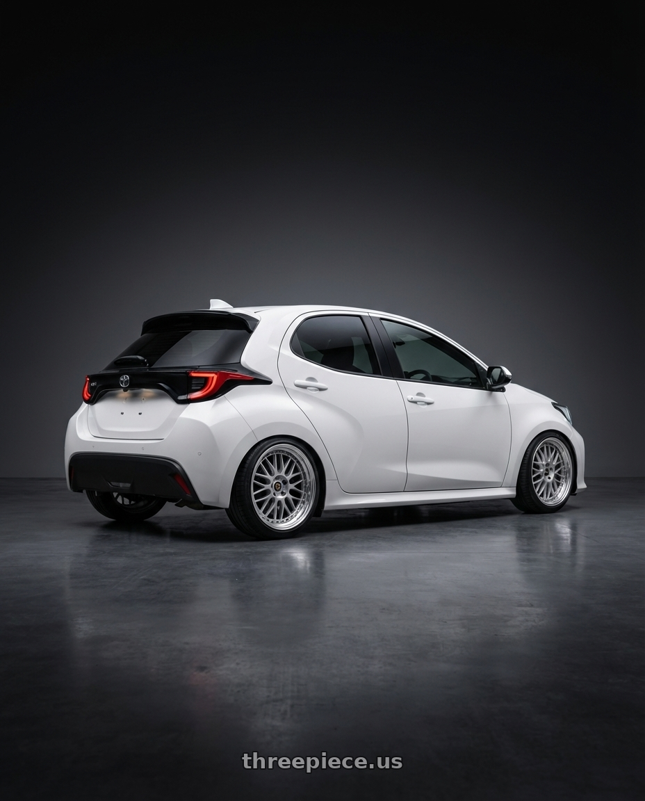 2021 Toyota Yaris with Work Vs-Xx 5x100 18x8.5+57 A Disk Light Grey Silver wheels rear three quarter view square tires