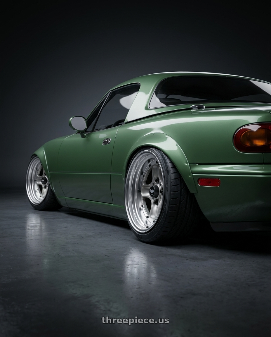 1997 Mazda Miata  with Work Equip 40 4x100 15x6 -3 a disk Brut Silver wheels rear three quarter view extreme stretch tires