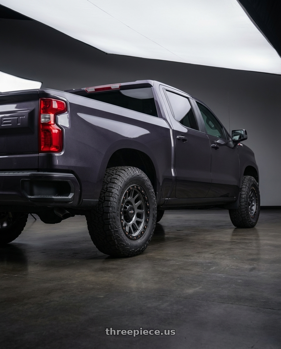 2023 Chevrolet Silverado 1500 with Vision Off-Road 111 Nemesis 6x139.7 20x9+0 Gunmetal wheels rear three quarter view meaty tires