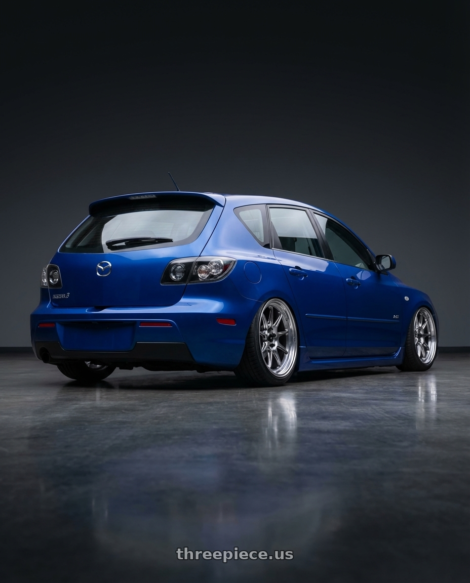 2008 mazda 3  aurora blue with Konig Countergram 5x114.3 18x8.5+35 Hyper Chrome / Machined Lip wheels rear three quarter view slight stretch tires