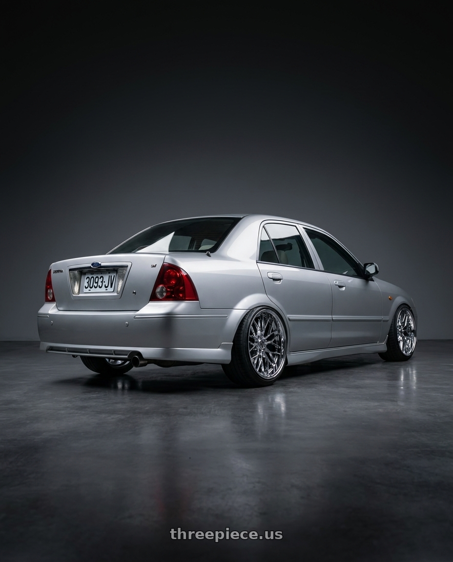 2004 ford tierra  with TIS Motorsports 505C 5x114.3 16x7.5 +35 Chrome wheels rear three quarter view extreme stretch tires