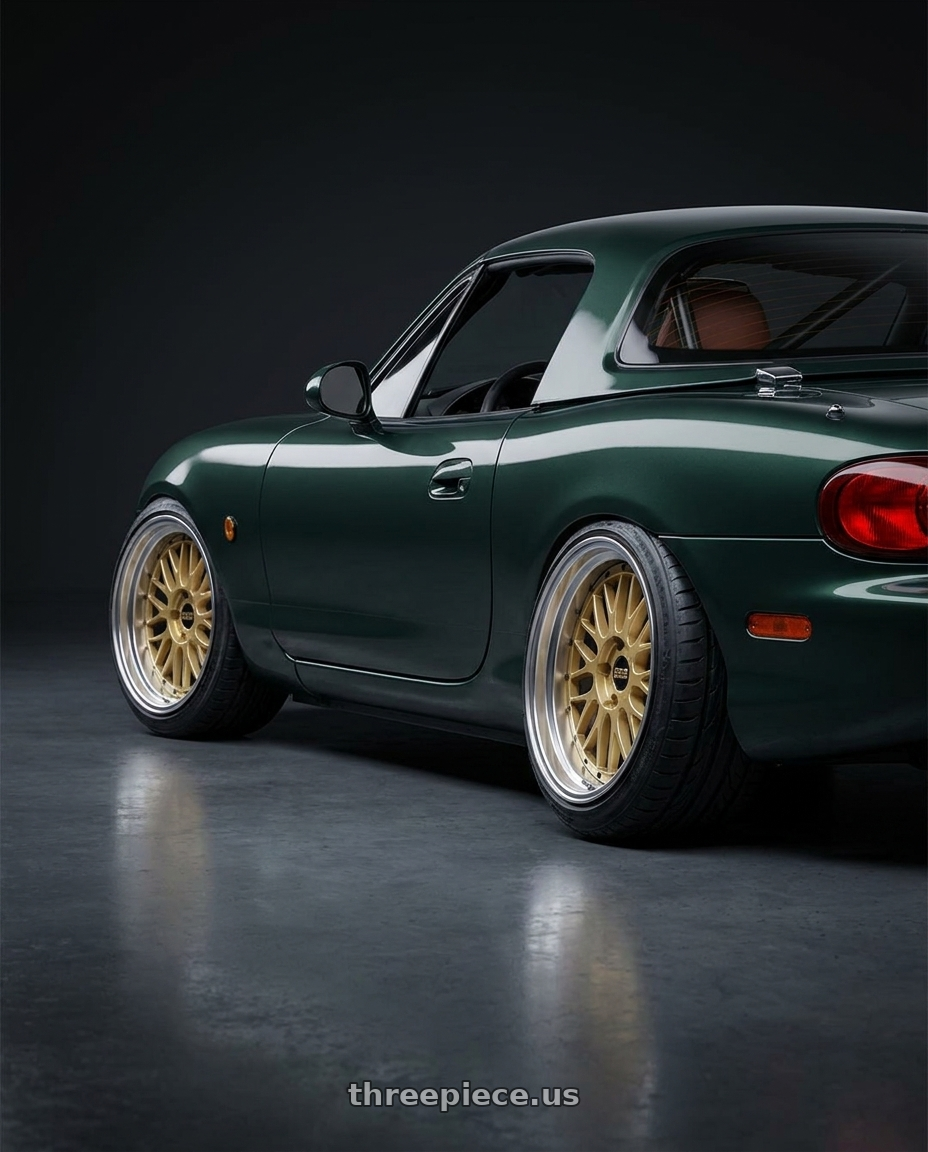 2000 Mazda Miata with BBS LM 5x114.3 17x7.5+38 Gold wheels rear three quarter view extreme stretch tires