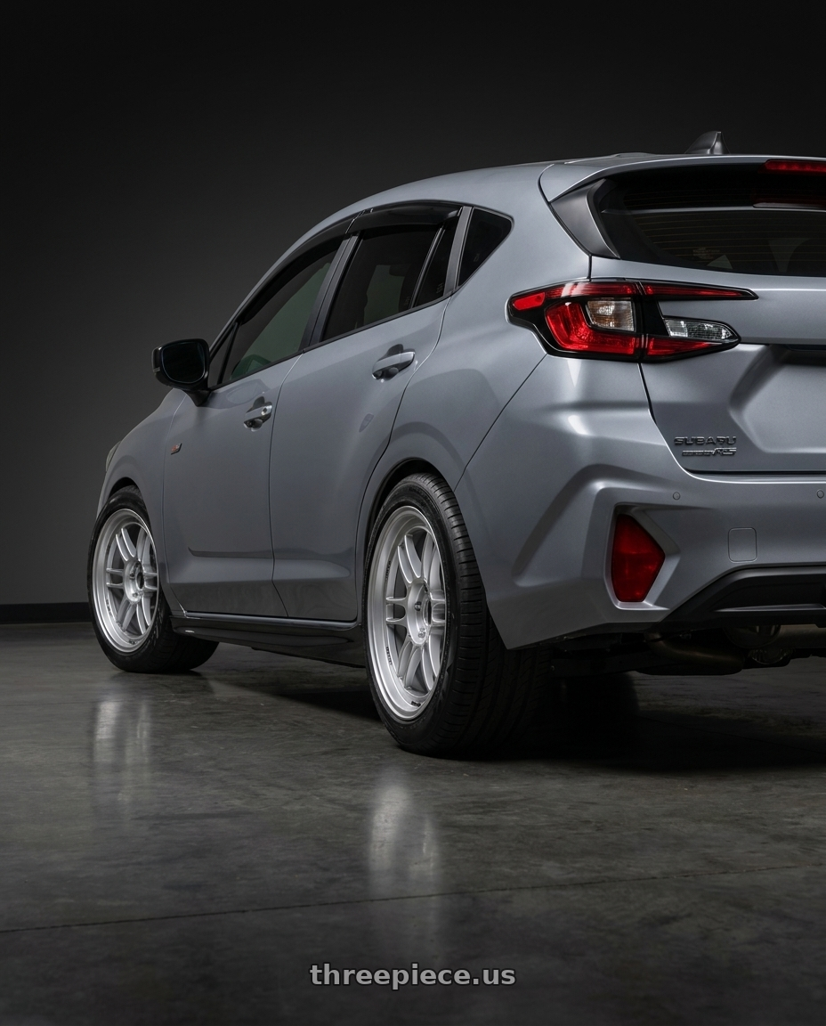 2024 Subaru Impreza RS with Enkei RPF1 5x114.3 18x8+35 Silver wheels rear three quarter view meaty tires