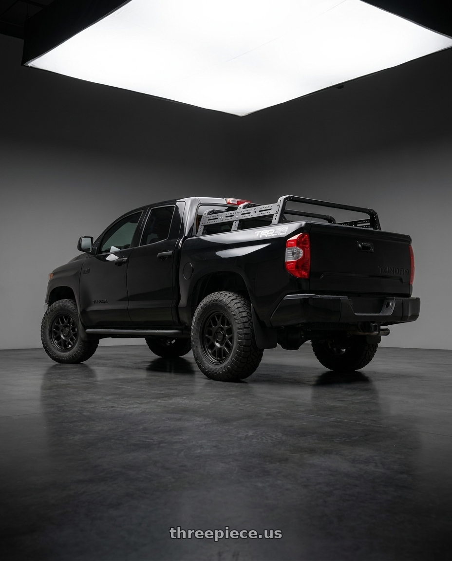 2020 Toyota Tundra  with KMC KM717 BULLY OL 5X150 17X8.5 +18 SATIN BLACK wheels rear three quarter view meaty tires