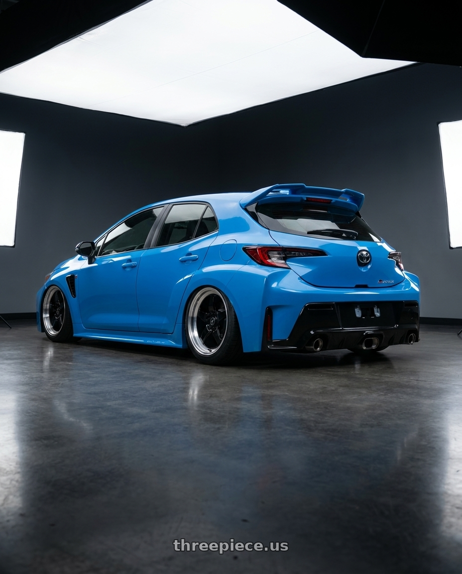 2024 Toyota GR Corolla with Forgestar D5 Drag 5x114.3 18x10 +22 Gloss Black Machined wheels rear three quarter view slight stretch tires