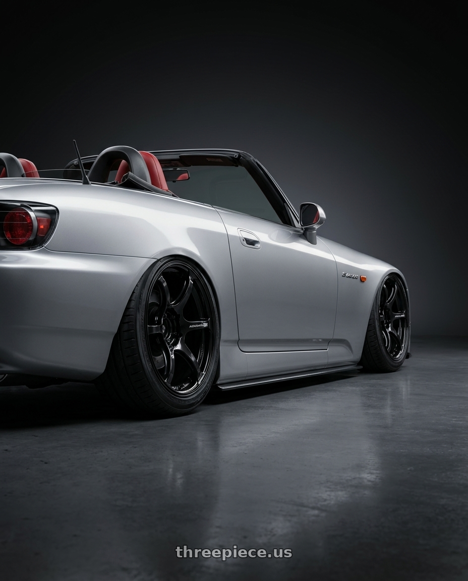 2009 Honda S2000 with Advan RGIII 5x114.3 18x10+35 Gloss Black wheels rear three quarter view slight stretch tires
