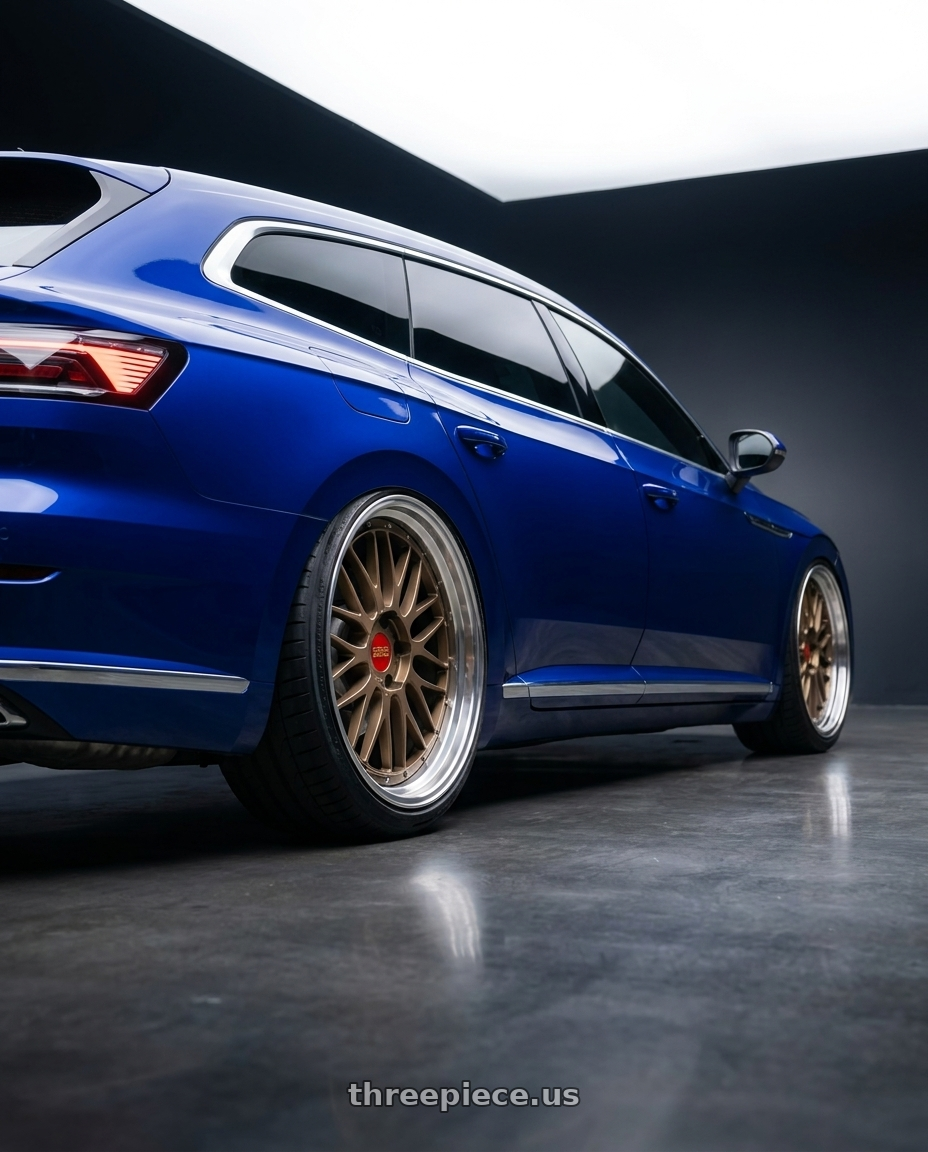 2023 vw Arteon shooting brake Lapiz Blue with BBS LM 5x112 20x10.0+22 Matte Bronze wheels rear three quarter view extreme stretch tires