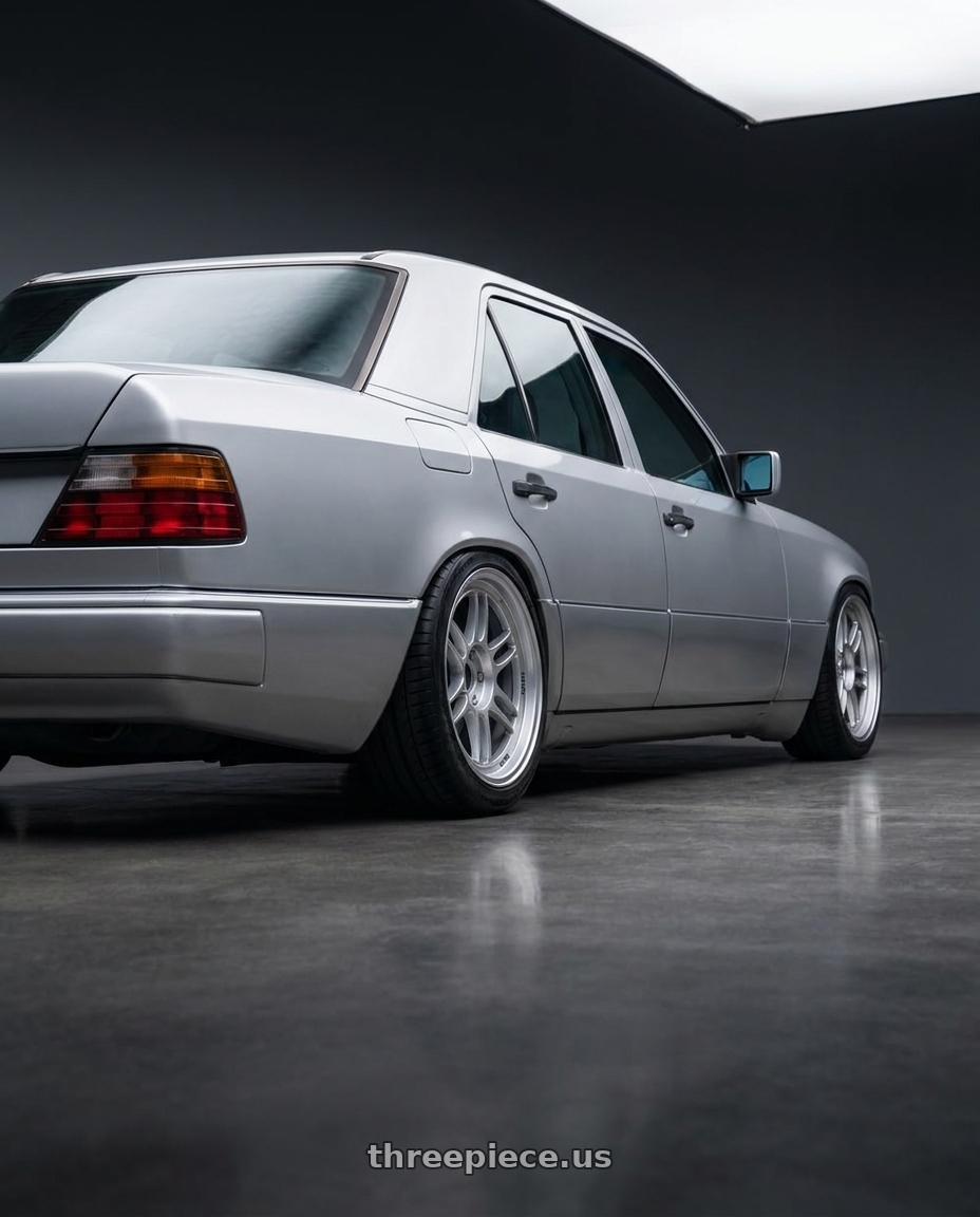 1994 W124 e220 with Enkei RPF1 5x112 18x8+35 Silver wheels rear three quarter view slight stretch tires
