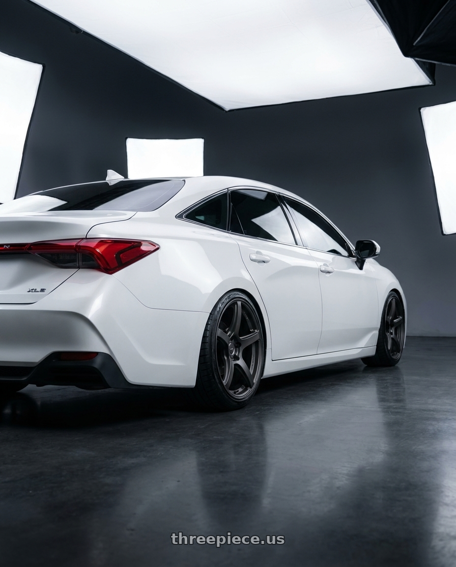 2022 Toyota Avalon xle white with Work Emotion T5r 5x114.3 19x8.5 +35 Matte Graphite wheels rear three quarter view slight stretch tires