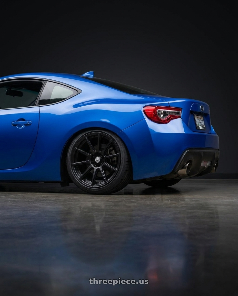 2017 Subaru BRZ with Konig Control 5x100/5x114.3 17x7+45 Matte Black wheels rear three quarter view slight stretch tires