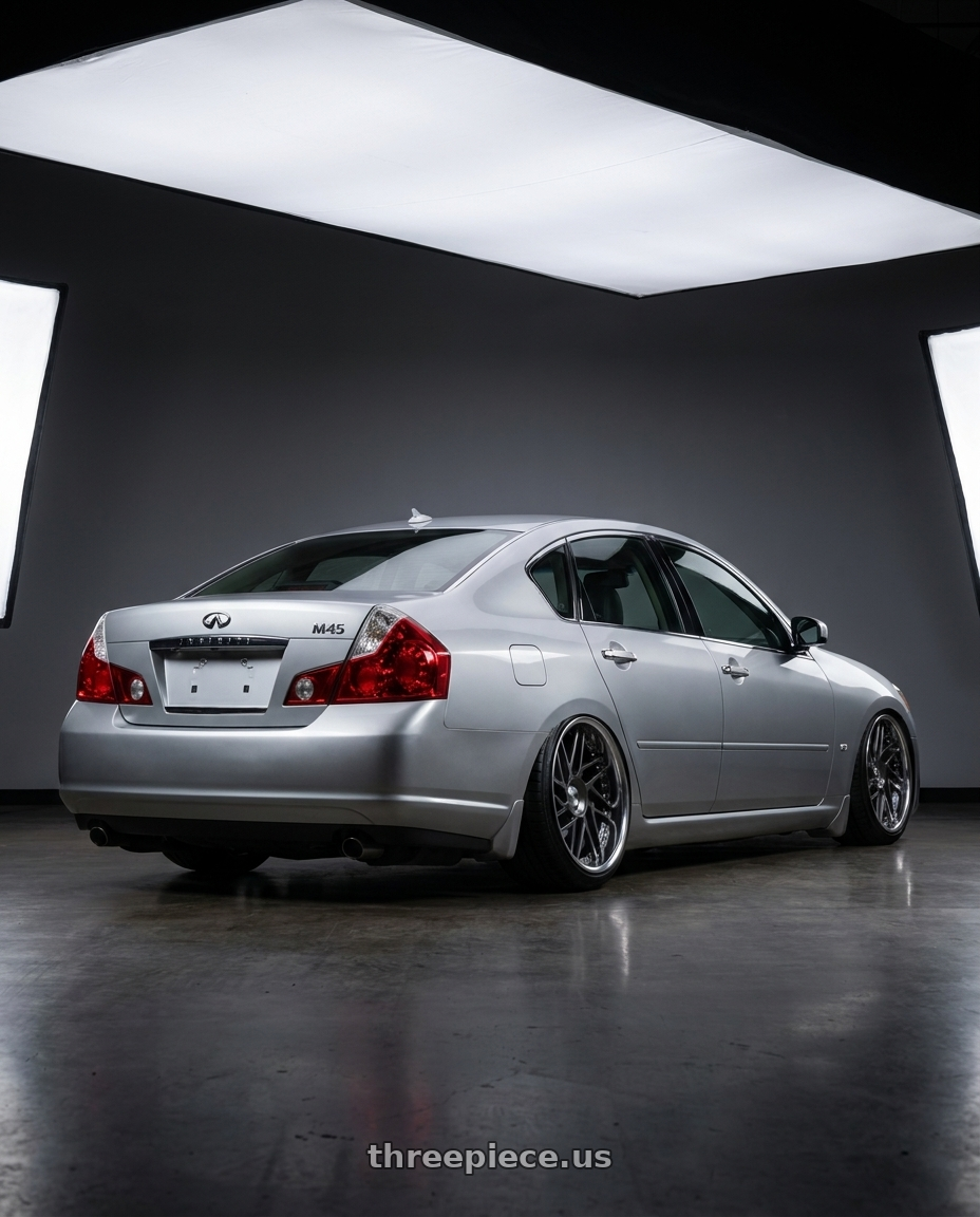 2007 Infiniti M45 with Leon Hardiritt Geist 20x10.5-36 Super Low Disk wheels rear three quarter view extreme stretch tires