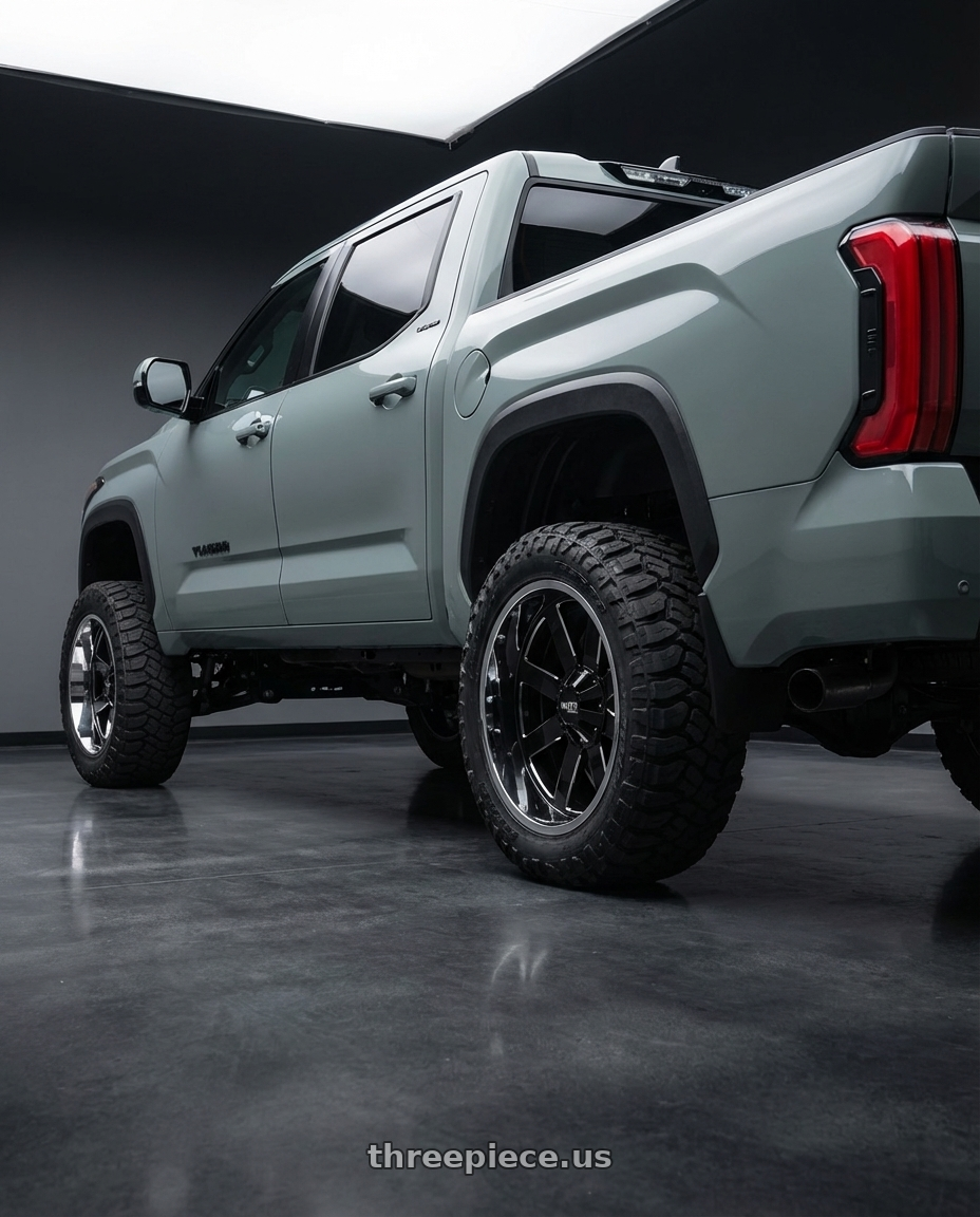 2024 Toyota Tundra with Moto Metal MO200 6X139.7 22X12 -44 GLOSS BLACK MILLED CENTER CHROME LIP wheels rear three quarter view meaty tires