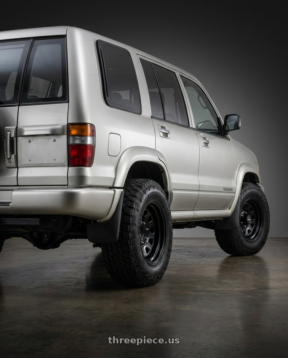 1998 Isuzu trooper with Vision HD 84H 6x139.7 16x8-12 Gloss Black wheels rear three quarter view meaty tires
