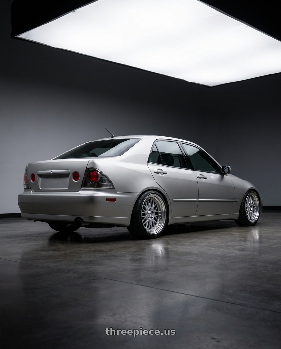 1999 Toyota Altezza Silver with Work Meister M1 3p 5x114.3 18x8+38 O Disk Silver wheels rear three quarter view square tires