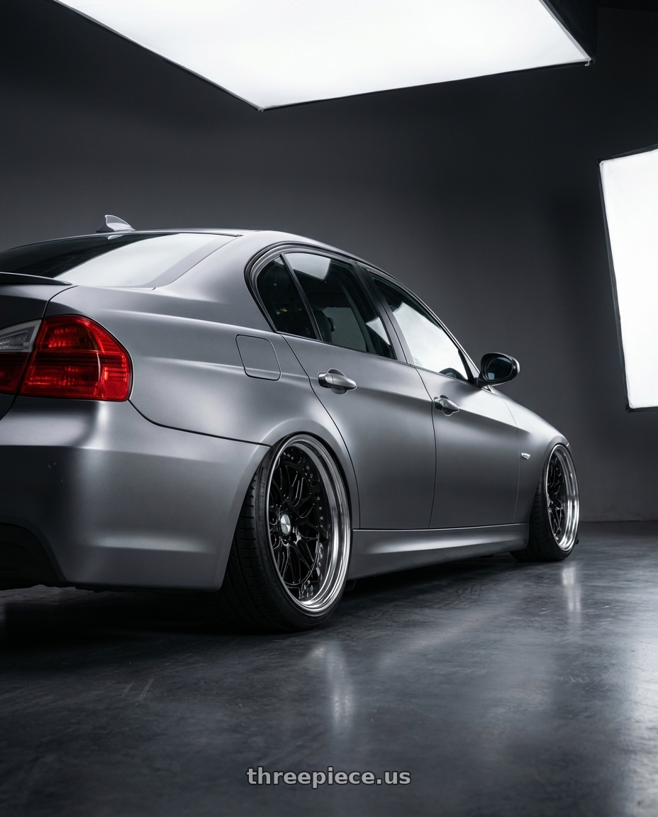 2010 bmw 320d with Work Gran Seeker Dmx 5x100 20x7.5+25 A Disk Black wheels rear three quarter view extreme stretch tires