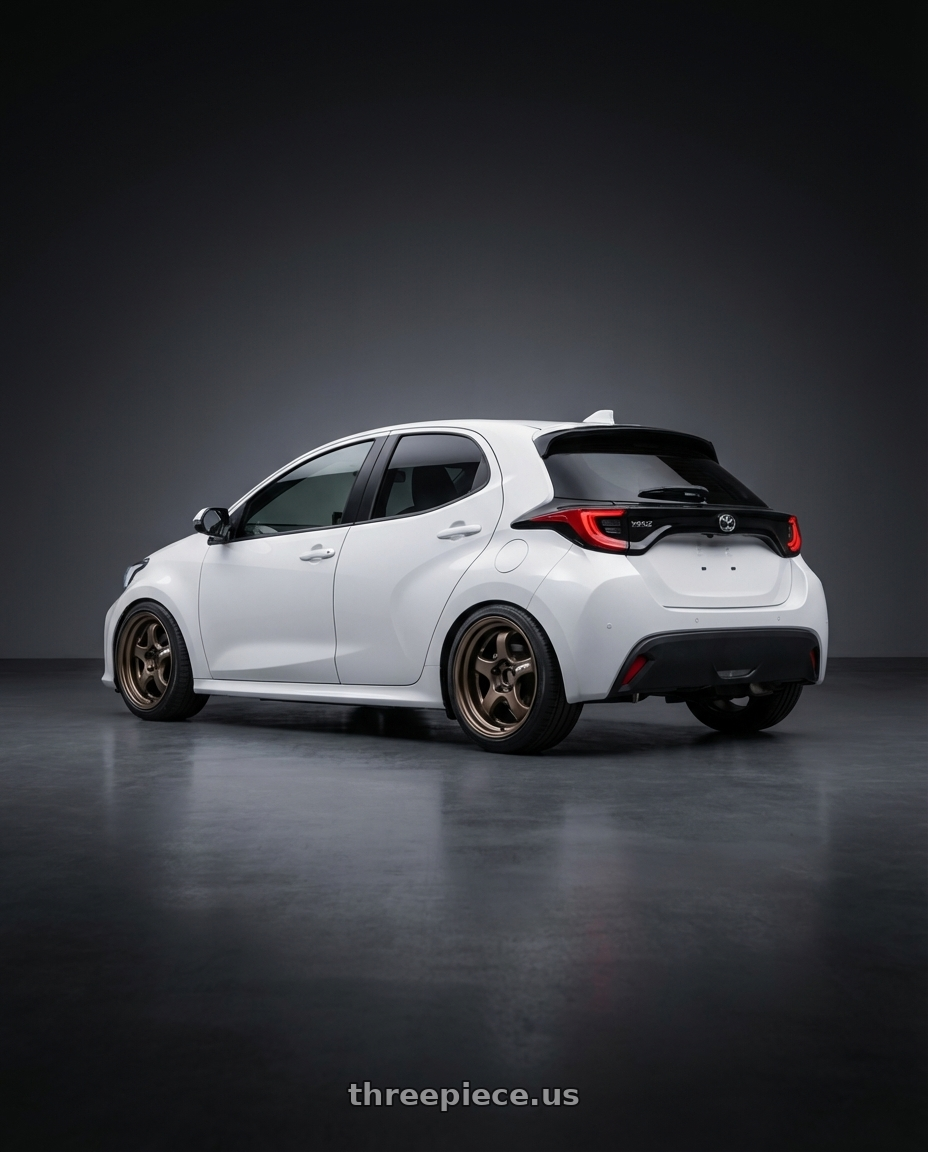 2021 Toyota Yaris  with Work Meister S1R 4x100 16x7.5+38 A Disk Ashdot Titanium wheels rear three quarter view square tires