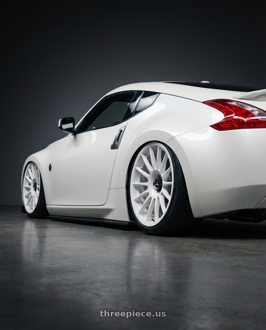 2019 Nissan 370Z with fifteen52 PODIUM 5x114.3 / 5x120 19x8.5 +35 RALLY WHITE (GLOSS WHITE) wheels rear three quarter view slight stretch tires